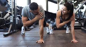 Toning Bingo Wings: Your Ultimate Guide to Sculpting Sleek Arms at the Gym 3 Fitness trainer demonstrating arm toning exercises Southend-on-Sea
