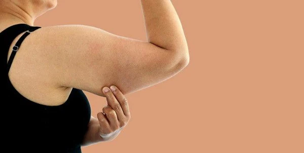 Toning Bingo Wings: Your Ultimate Guide to Sculpting Sleek Arms at the Gym 1 Woman doing push-ups for arm strength Southend-on-Sea