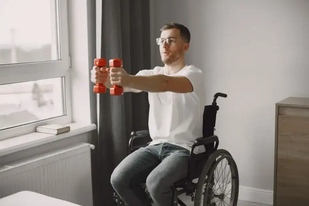 Image of man doing exercise in his wheelchair to aid weight loss Southend-on-Sea